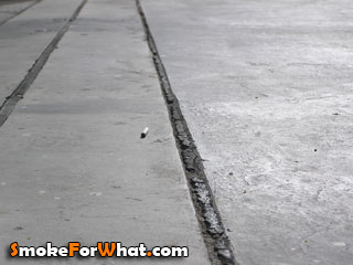 Cigarette butt found on the ground of block 3 Tanjong Pagar Plaza Singapore